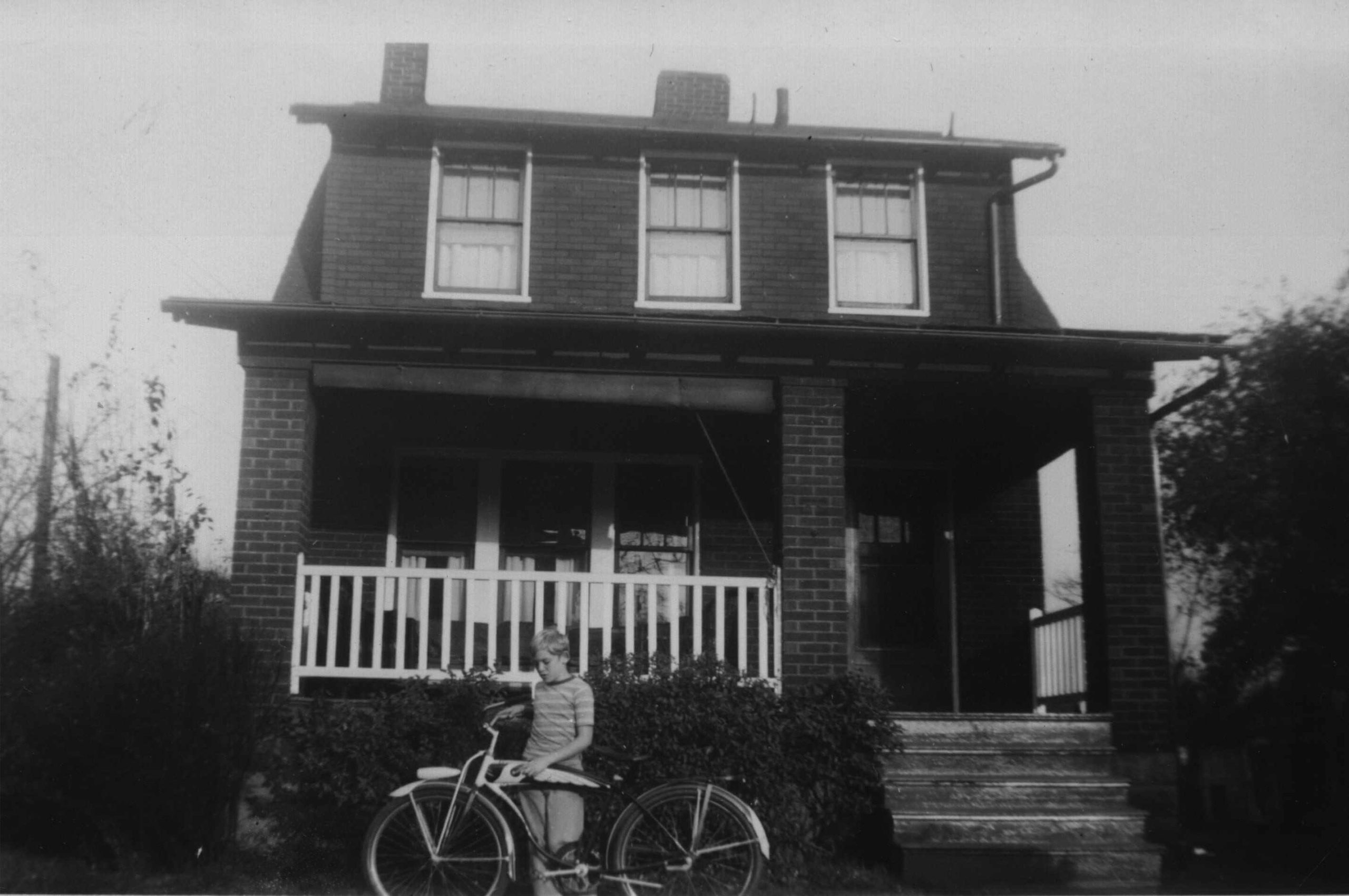 Burt Kennedy Jr. with bike “SUSIE” in front of 240 Philander Street.